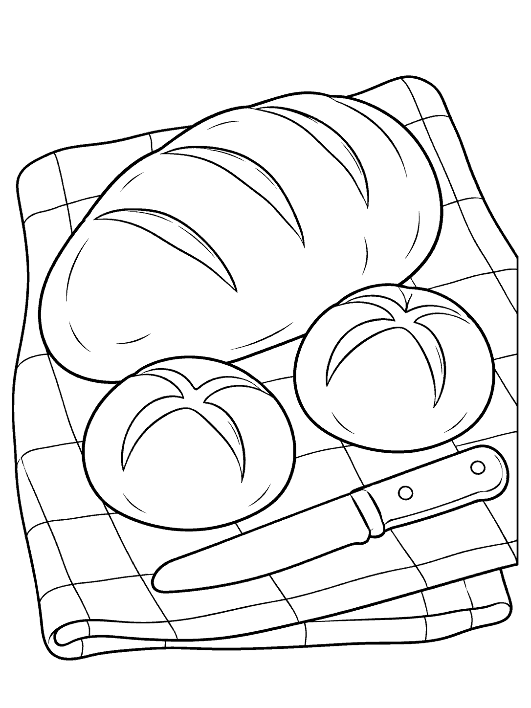 A loaf and two rolls with a blunt bread knife on a checked picnic cloth.