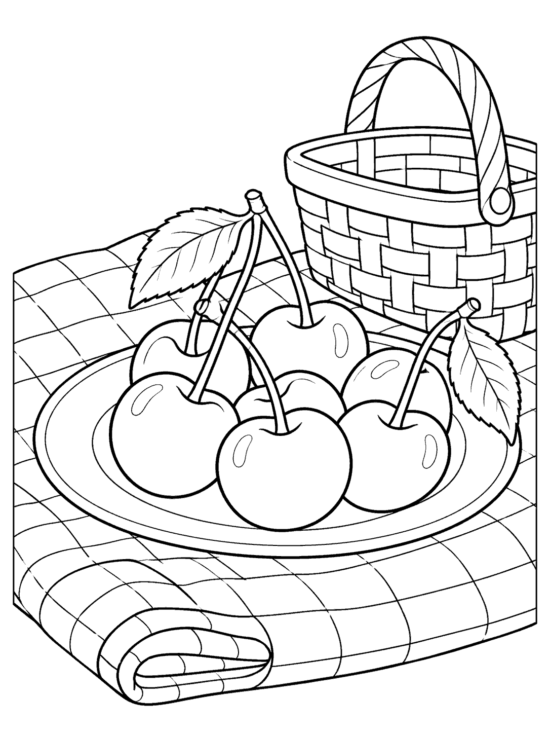 Large cherries with leaves on a plate, arranged on a checked picnic blanket beside a basket.