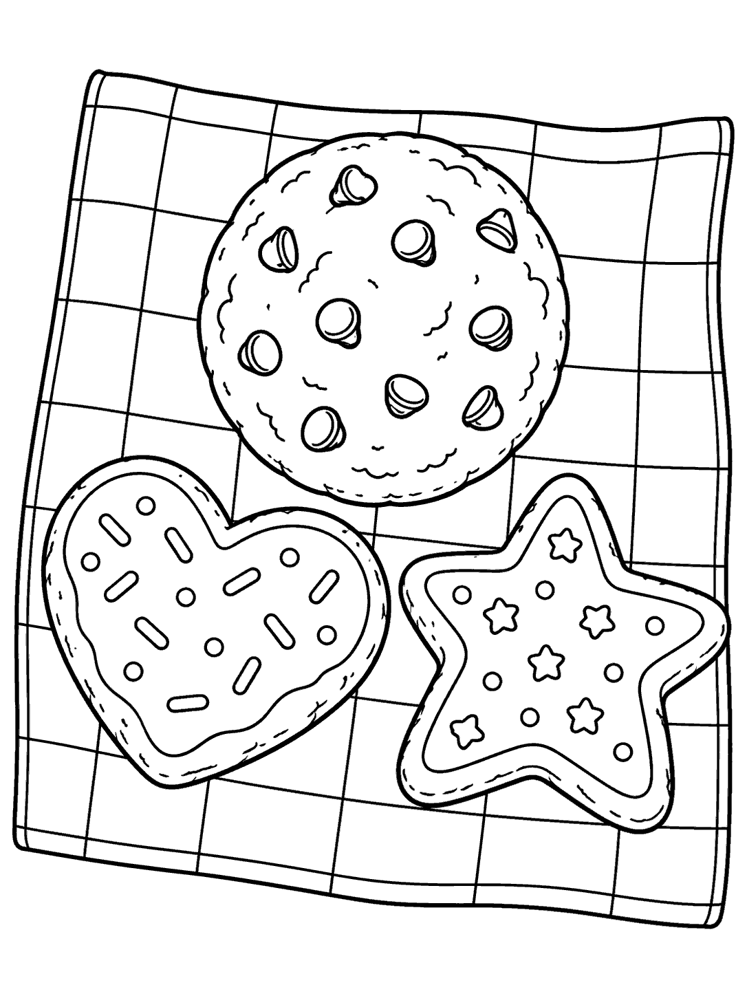 Black-and-white coloring page showing a round chocolate chip cookie, a heart cookie, and a star cookie on a broad-check picnic cloth.