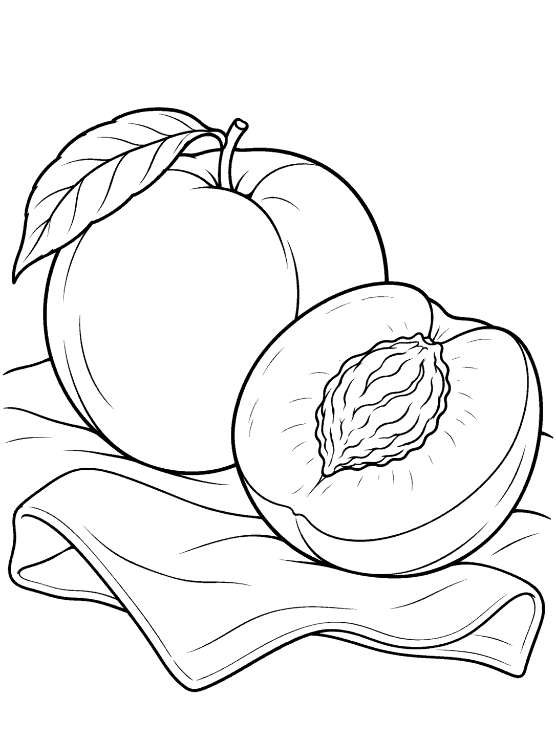 Whole and halved peach on a folded napkin