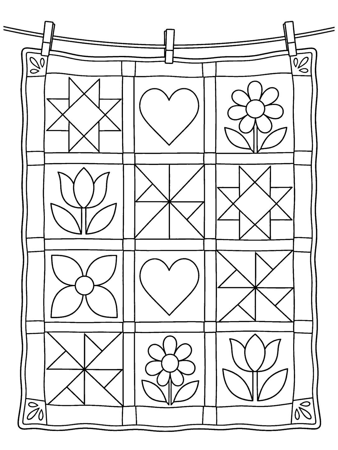 Printable patchwork quilt with star, heart, flower, and pinwheel blocks hanging from a clothesline with clothespins.